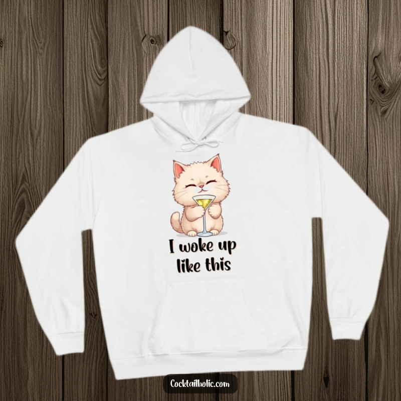 Funny Cat Martini Hoodie: A fluffy cat winks playfully while holding a tiny martini glass, offering cozy humor and style.